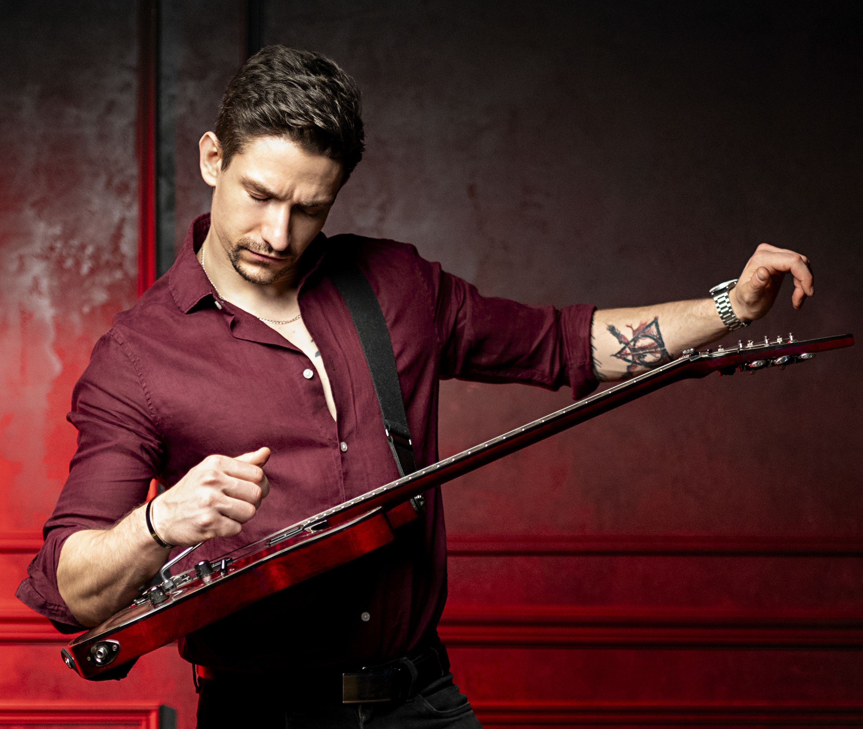profile-picture-holding-a-guitar